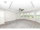 Bright bedroom features neutral carpet, ceiling fan, recessed lights, and large windows at 6160 Hardwick Dr, Whitestown, IN 46075