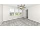 Bedroom with three large windows, ceiling fan, carpet floors and bright paint at 6160 Hardwick Dr, Whitestown, IN 46075