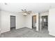Spacious bedroom with carpet flooring, ceiling fan, and access to the bathroom and closet at 6160 Hardwick Dr, Whitestown, IN 46075