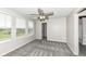 Bedroom with three large windows, ceiling fan, carpet floors and bright paint at 6160 Hardwick Dr, Whitestown, IN 46075