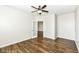 This bedroom features durable, hardwood flooring, a ceiling fan and a glass door to an adjoining room at 6160 Hardwick Dr, Whitestown, IN 46075