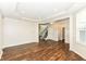 Spacious living room with hardwood floors, neutral paint, recessed lights and staircase access at 6160 Hardwick Dr, Whitestown, IN 46075