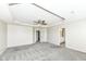 Large main bedroom boasts a tray ceiling, ceiling fan, and an attached bathroom at 6160 Hardwick Dr, Whitestown, IN 46075