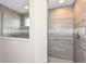 Luxurious walk-in shower featuring designer tile, glass door, and sleek fixtures at 6160 Hardwick Dr, Whitestown, IN 46075