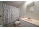 Standard bathroom featuring a vanity with a sink, toilet, and a shower with a decorative blue patterned curtain at 640 Shady Creek Ct, Greenwood, IN 46142