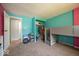 Bright bedroom featuring pink and turquoise walls, an elevated platform bed, and a closet with shelving at 640 Shady Creek Ct, Greenwood, IN 46142
