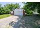 Quaint single Gathering home with a two car garage and expansive driveway surrounded by mature trees at 640 Shady Creek Ct, Greenwood, IN 46142