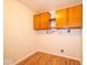 Functional laundry room with overhead cabinets and clean, neutral walls at 640 Shady Creek Ct, Greenwood, IN 46142