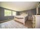 Serene main bedroom with plush carpet, natural light, and elegant furnishings at 640 Shady Creek Ct, Greenwood, IN 46142