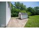 Backyard view featuring a well-maintained storage shed with a concrete base next to the house at 640 Shady Creek Ct, Greenwood, IN 46142