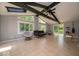 Bright sunroom with ceiling fan, skylights, and large windows overlooking the backyard at 640 Shady Creek Ct, Greenwood, IN 46142