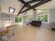 Inviting sunroom with beamed ceilings, skylights and backyard access at 640 Shady Creek Ct, Greenwood, IN 46142