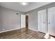 Comfortable bedroom with hardwood floors and closet space, designed for relaxation and organized living at 6514 Jackson St, Indianapolis, IN 46241