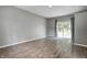 Light-filled bedroom with a sliding glass door leading to a private outdoor space at 6514 Jackson St, Indianapolis, IN 46241