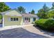 Charming yellow home with a well-manicured lawn and inviting front entrance at 6514 Jackson St, Indianapolis, IN 46241