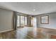 Spacious living room features hardwood floors and large windows, creating a bright and airy atmosphere at 6514 Jackson St, Indianapolis, IN 46241
