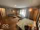 Inviting living room with a patterned rug, comfortable sofas, and natural lighting at 6514 Jackson St, Indianapolis, IN 46241