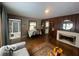 Inviting living room featuring a fireplace, hardwood floors, and an open layout at 6514 Jackson St, Indianapolis, IN 46241