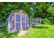 View of the backyard shed in a backyard with green grass at 6514 Jackson St, Indianapolis, IN 46241