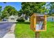 Charming neighborhood with a community book exchange and view of the front of the home at 6514 Jackson St, Indianapolis, IN 46241