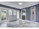 Spacious sunroom with decorative windows and tile flooring, perfect for relaxation at 6514 Jackson St, Indianapolis, IN 46241
