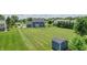 Large backyard with a shed, mature trees, and well-maintained lawn, offering ample space and scenic views at 6702 W Willow Grove Dr, New Palestine, IN 46163