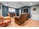 Finished basement with movie screen, comfortable seating, and bright lighting at 6702 W Willow Grove Dr, New Palestine, IN 46163