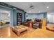 Finished basement featuring multiple seating areas, a bright ceiling, and updated floors at 6702 W Willow Grove Dr, New Palestine, IN 46163