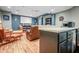 Finished basement with kitchenette, movie screen, and comfortable seating area at 6702 W Willow Grove Dr, New Palestine, IN 46163