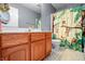 Bathroom with a sink and vanity and a shower with a monkey-themed curtain at 6702 W Willow Grove Dr, New Palestine, IN 46163