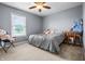 Neutral-toned bedroom featuring a bed, large window, and carpet flooring at 6702 W Willow Grove Dr, New Palestine, IN 46163