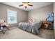 Bedroom featuring neutral walls, carpet, ceiling fan, and a chair with a teddy bear at 6702 W Willow Grove Dr, New Palestine, IN 46163