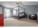 Bedroom featuring a canopy bed, cathedral ceilings, and carpet floors at 6702 W Willow Grove Dr, New Palestine, IN 46163