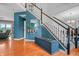 Inviting foyer with hardwood floors, staircase, and elegant decor at 6702 W Willow Grove Dr, New Palestine, IN 46163