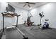 Home gym featuring modern exercise equipment, a ceiling fan, and rubber flooring at 6702 W Willow Grove Dr, New Palestine, IN 46163