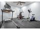 Home gym featuring an elliptical, treadmill, and free weights for in-home workouts at 6702 W Willow Grove Dr, New Palestine, IN 46163