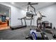 Home gym featuring an elliptical, treadmill, and free weights for in-home workouts at 6702 W Willow Grove Dr, New Palestine, IN 46163