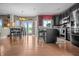 Spacious kitchen area featuring dark cabinets, a breakfast bar and stainless steel appliances at 6702 W Willow Grove Dr, New Palestine, IN 46163