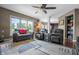 Open concept living room featuring a window, furniture, and access to other rooms at 6702 W Willow Grove Dr, New Palestine, IN 46163