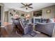 Inviting living room featuring comfortable seating, a fireplace, and a ceiling fan at 6702 W Willow Grove Dr, New Palestine, IN 46163