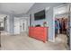 A carpeted area with a red dresser and a flat screen TV; walk-in closet and bathroom entrances visible at 6702 W Willow Grove Dr, New Palestine, IN 46163