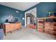 Office space with blue walls, hard wood floors in hallway, and lots of natural light, perfect for work or study at 6702 W Willow Grove Dr, New Palestine, IN 46163