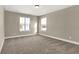Bright bedroom featuring plush carpeting, neutral paint, and natural light from the double windows at 6770 W Buck Stone Dr, McCordsville, IN 46055
