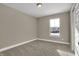 Neutral bedroom with carpeting and natural light, with a conveniently located door on the right at 6770 W Buck Stone Dr, McCordsville, IN 46055