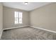 Comfortable bedroom featuring plush carpet, neutral paint, and a window with natural light at 6770 W Buck Stone Dr, McCordsville, IN 46055