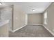 Versatile bonus room with plush carpeting, offering ample space for recreation or hobbies at 6770 W Buck Stone Dr, McCordsville, IN 46055