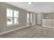 Second floor bonus room with carpet and natural light to make a comfortable living space at 6770 W Buck Stone Dr, McCordsville, IN 46055