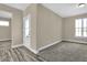 Multi-purpose flex space showcasing plush carpet, neutral paint, and a door to the outside at 6770 W Buck Stone Dr, McCordsville, IN 46055
