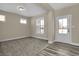Versatile flex space with natural light from multiple windows, and plush carpeting at 6770 W Buck Stone Dr, McCordsville, IN 46055