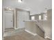 Upstairs hallway with carpet and lighting leading to various rooms of the home at 6770 W Buck Stone Dr, McCordsville, IN 46055